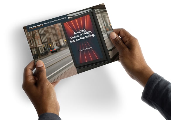 Hands holding a guide named Avoiding Common Pitfalls in Local Marketing