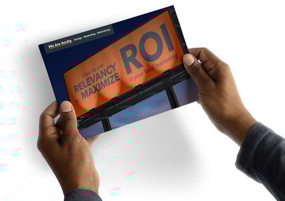 Hands holding a guide named How to Use Relevancy to Maximise ROI in Your Local Marketing