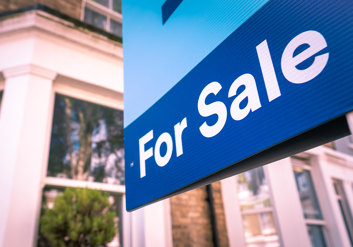 Estate Agency boards on a High Street.