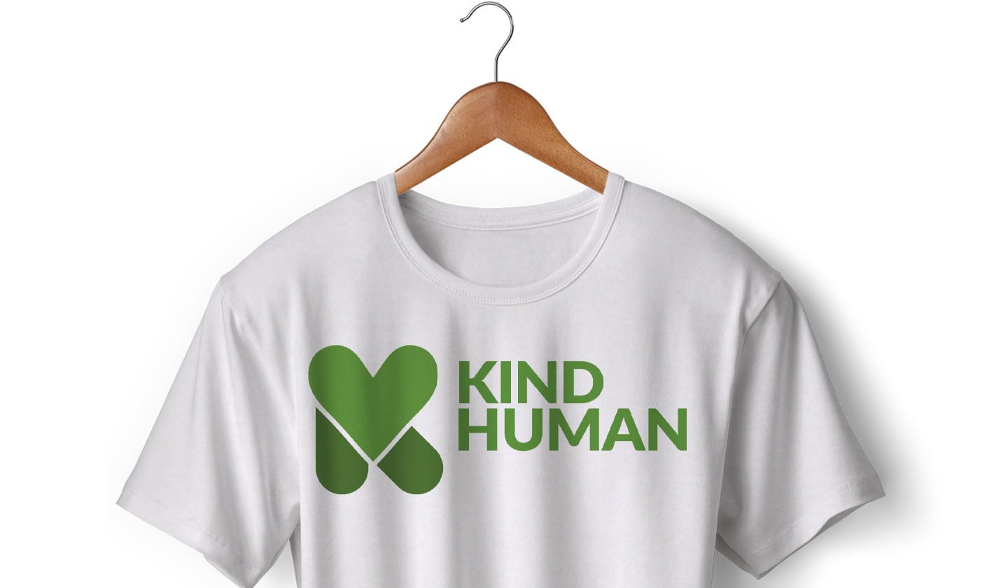 White tee with KIND HUMAN and green heart logo