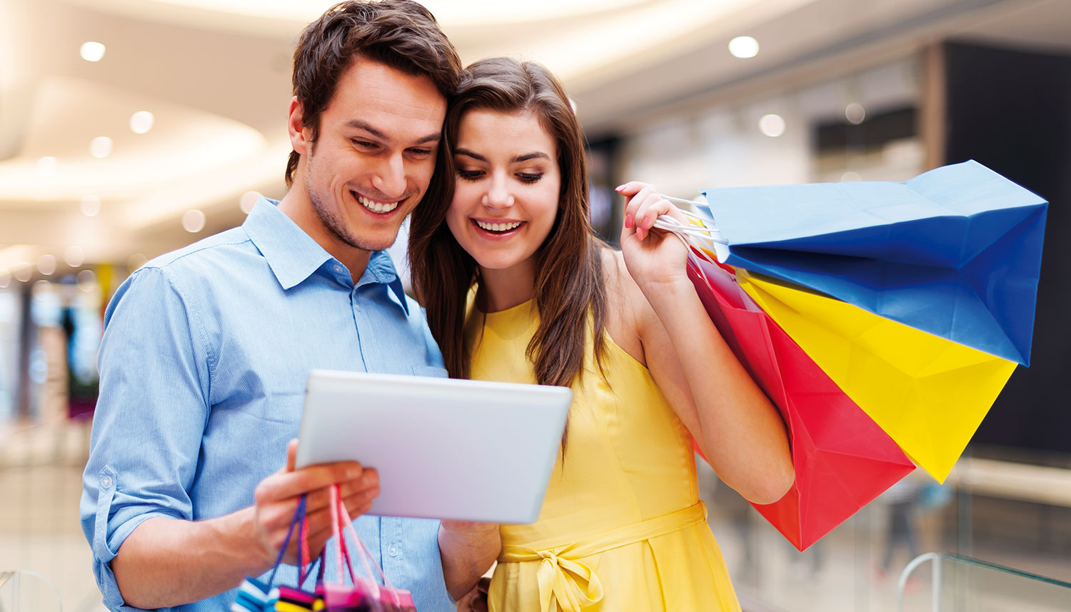 couple shopping looking at a photograph